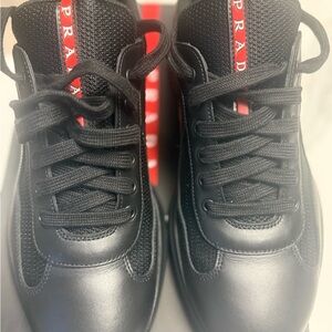 Prada Nero Sneakers with Red Stripe